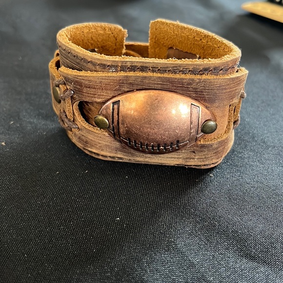 Other - Plunder leather snap cuff with copper football
